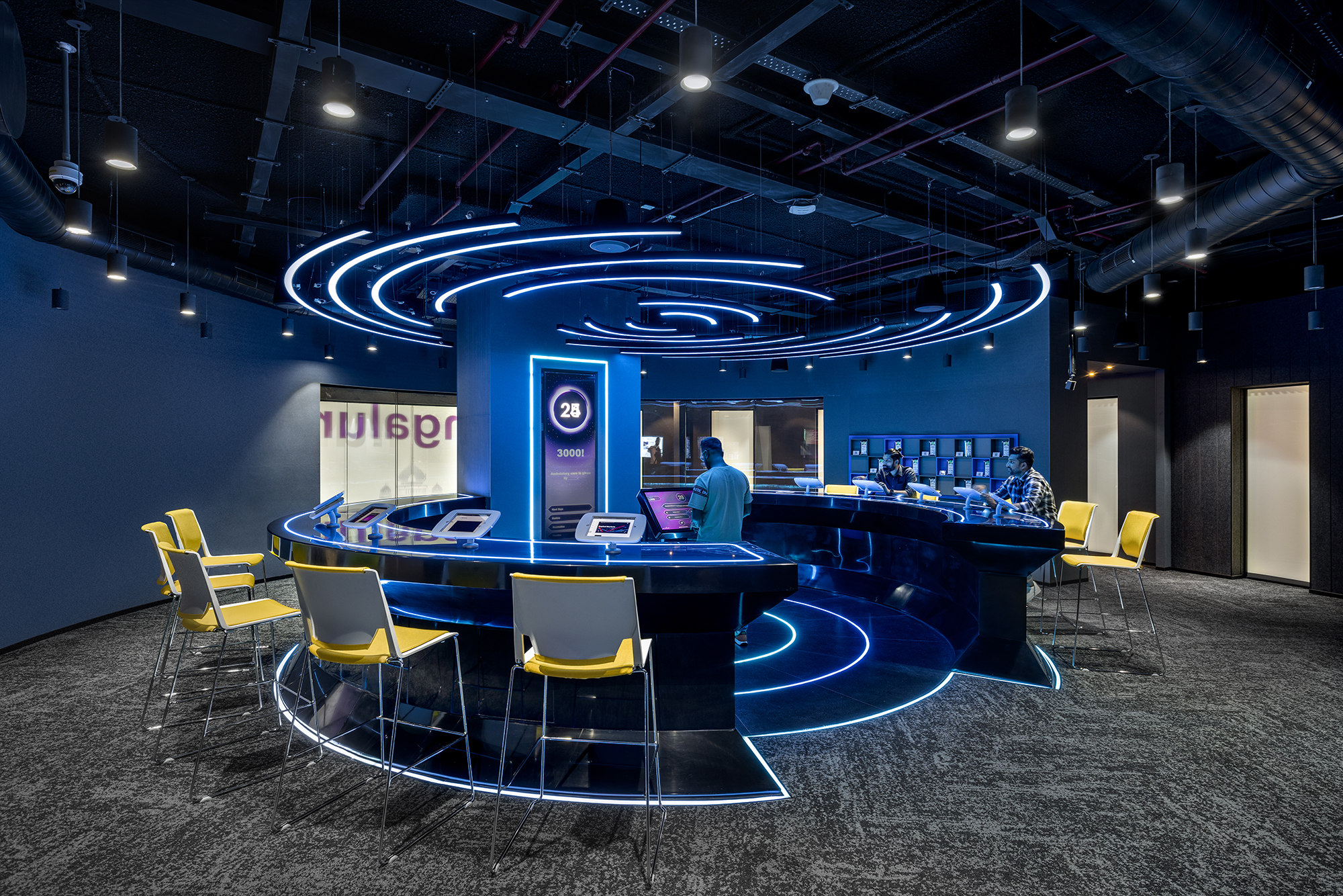 Gamification Experience — circular gameshow arena with synchronised tablets and LED neon ring lighting